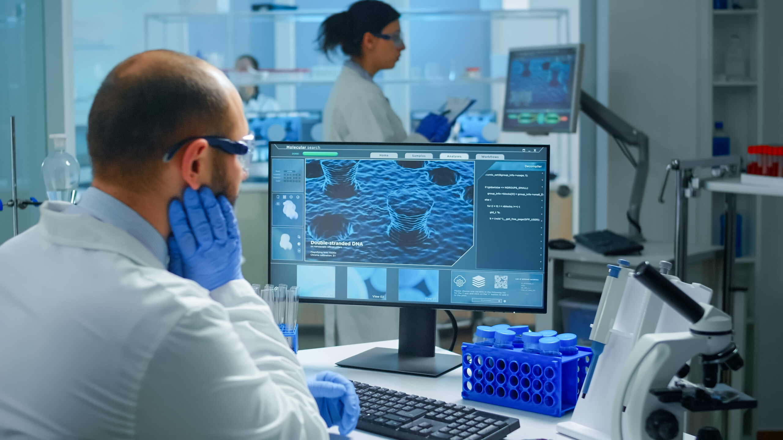 worried-chemist-doctor-working-pc-examining-vaccine-evolution-scientific-modern-equipped-laboratory